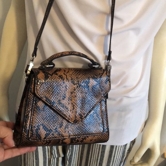 Urban Outfitters Handbags - Snake Skin Style Crossbody bag.  Very cute bag that fits the essentials.